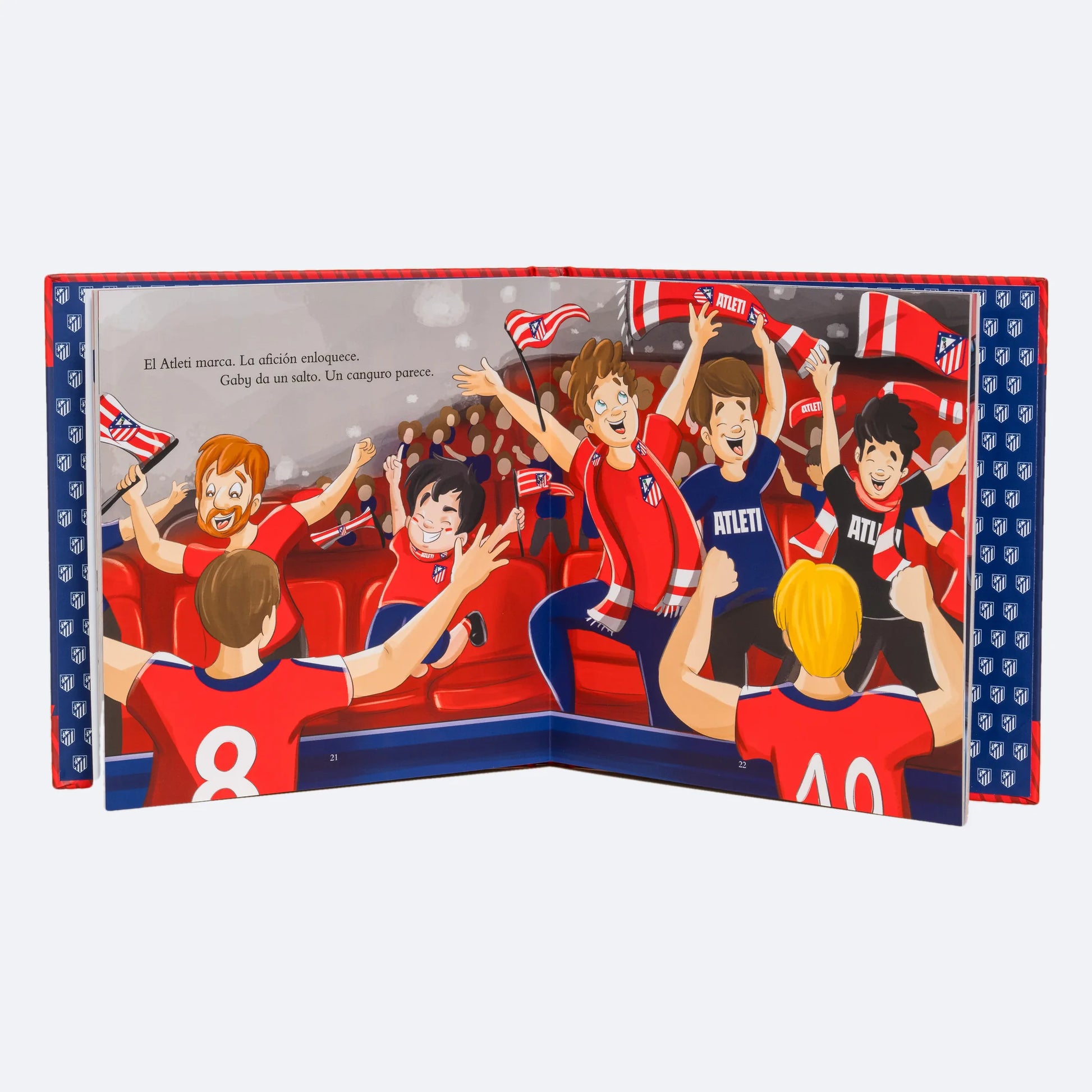 El libro personalizado de pie y abierto en la doble página de la grada, con el niño entre los aficionados del Atleti.