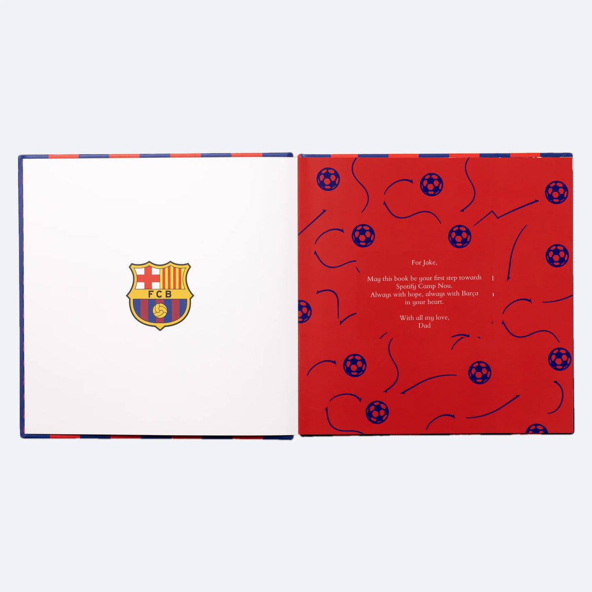 The FC Barcelona Personalised Book lying open at the dedication page, the words the buyer writes printed in white on red.