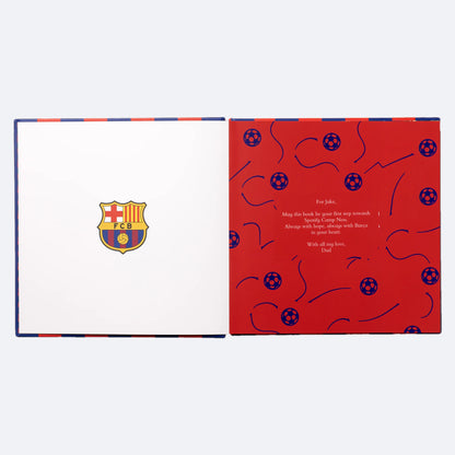 The FC Barcelona Personalised Book lying open at the dedication page, the words the buyer writes printed in white on red.