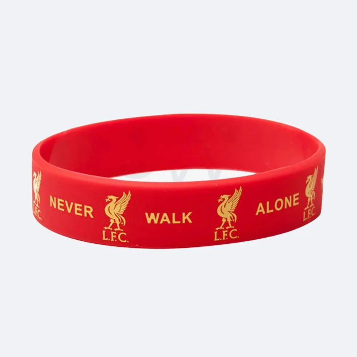 Liverpool FC red silicone wristband reading Never Walk Alone, on a grey ground