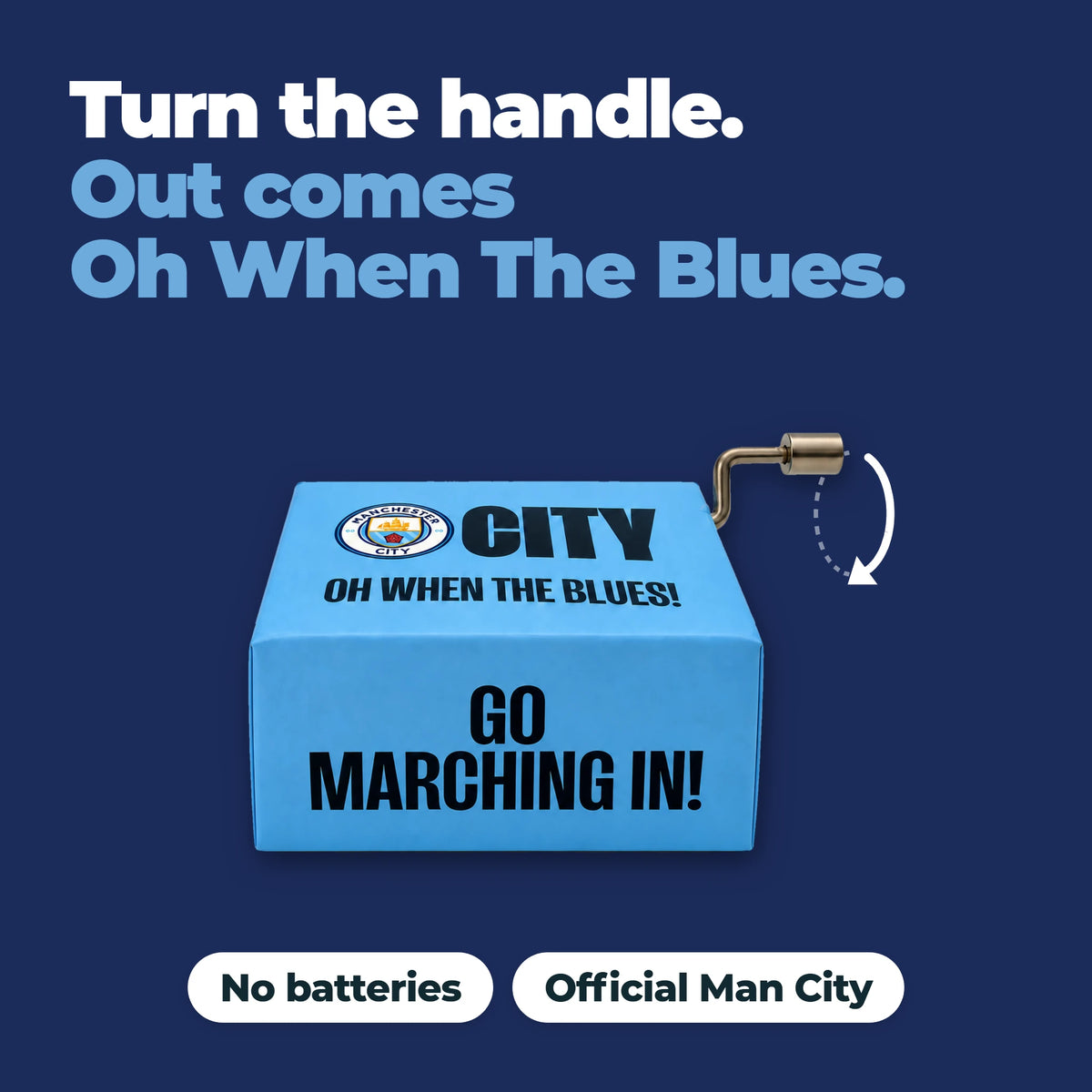 La caja de música del Manchester City con una flecha que muestra cómo gira la manivela: gira la manivela y suena Oh When The Blues. Sin pilas, oficial del Manchester City.