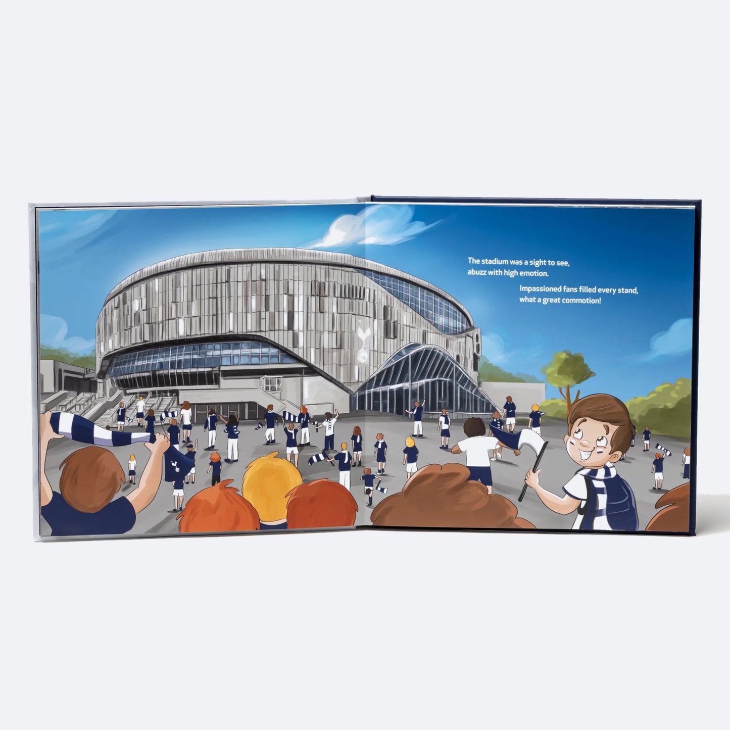 The Personalised Book standing open at the arrival spread, the child among the crowd outside Tottenham Hotspur Stadium.