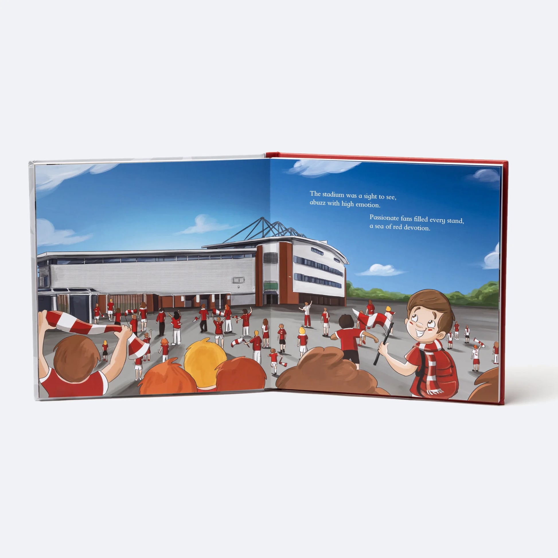 The Personalised Book open at the arrival spread, the child among the crowd outside the Racecourse Ground.